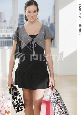 Woman carrying shopping bags Woman carrying shopping bags 10373094