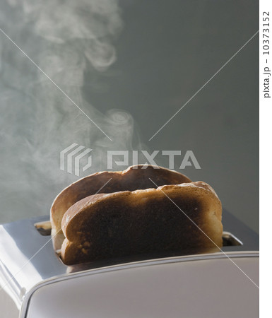 Toast burning in toaster Toast burning in toaster 10373152