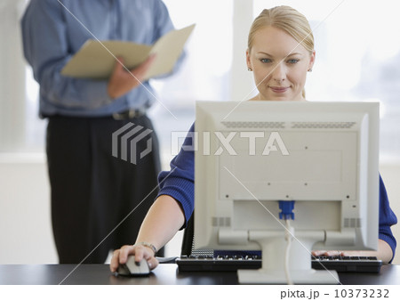 Businesswoman using computer at desk 10373232
