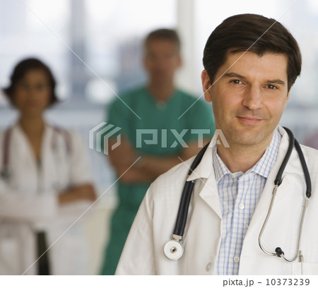 Male doctor wearing stethoscope Male doctor wearing stethoscope 10373239