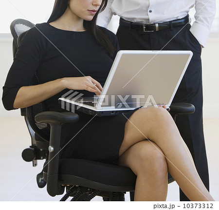 Businesswoman typing on laptop 10373312
