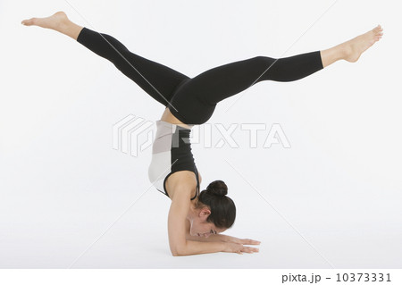 Woman practicing yoga Woman practicing yoga 10373331