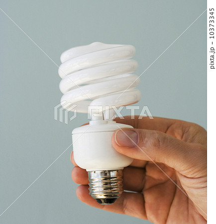 Man holding energy efficient light bulb 10373345