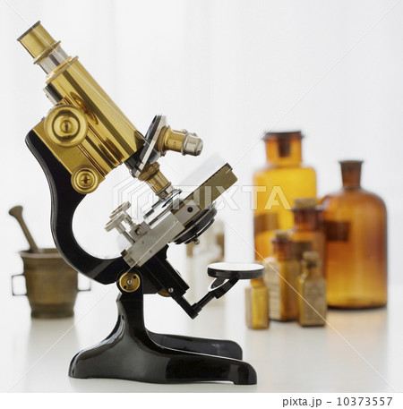 Old fashioned microscope and bottles 10373557