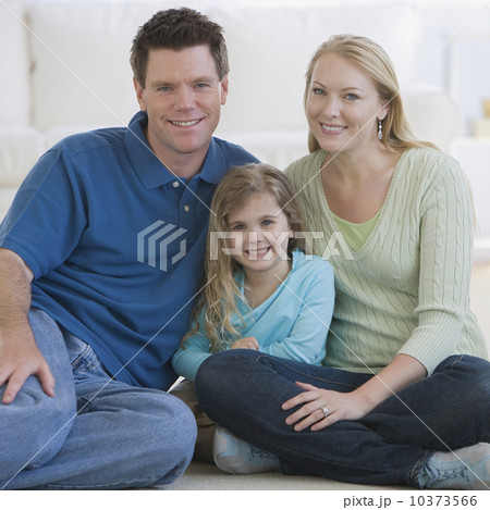 Portrait of family sitting on floor Portrait of family sitting on floor 10373566