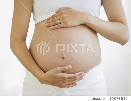 Pregnant woman with hands on belly 10373612