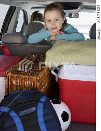 Girl in car with picnic supplies 10373622