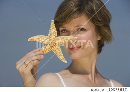 Woman holding starfish 10373657