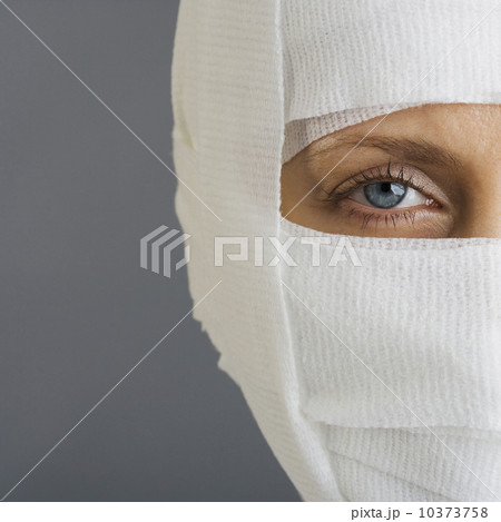 Woman’s face wrapped in bandages Woman’s face wrapped in bandages 10373758