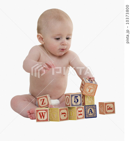 Studio shot of baby playing with blocks Studio shot of baby playing with blocks 10373800