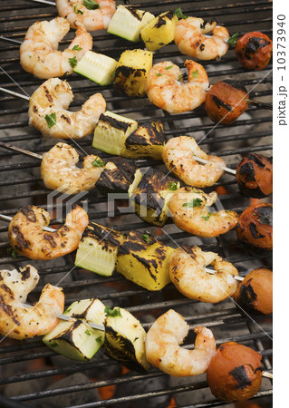 Shish kebab cooking on grill 10373940