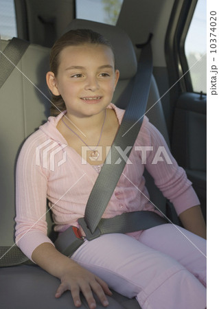 Girl sitting in backseat of car 10374020