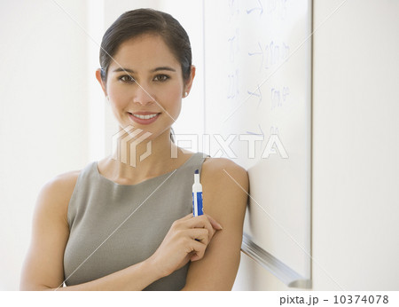 Businesswoman next to dry erase board Businesswoman next to dry erase board 10374078