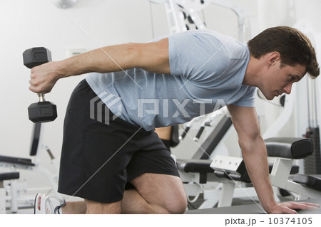 Man exercising with weight 10374105