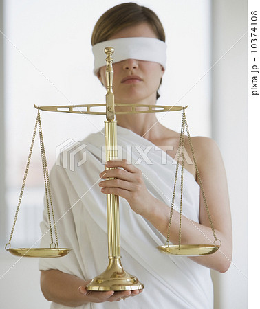 Blindfolded woman holding scales Blindfolded woman holding scales 10374108