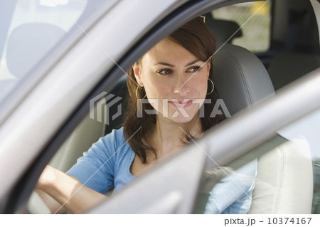 Young woman in driver’s side of car 10374167