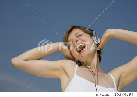 Woman listening to headphones 10374294