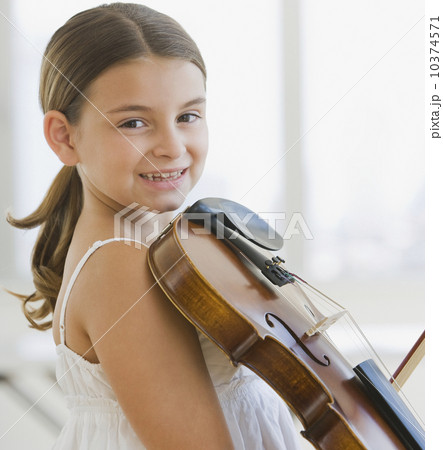 Girl holding violin 10374571