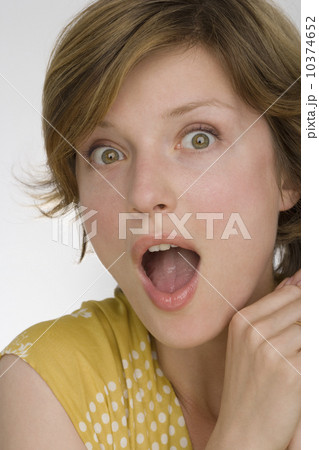 Close up of woman looking surprised Close up of woman looking surprised 10374652