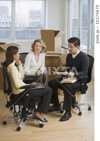 Multi-ethnic businesspeople in new office 10374670