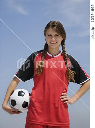 Girl holding soccer ball 10374696