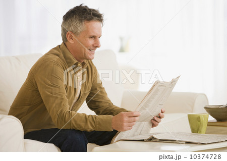 Man reading newspaper 10374728