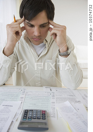 Man preparing taxes 10374732