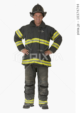 Male firefighter with hands on hips 10374744