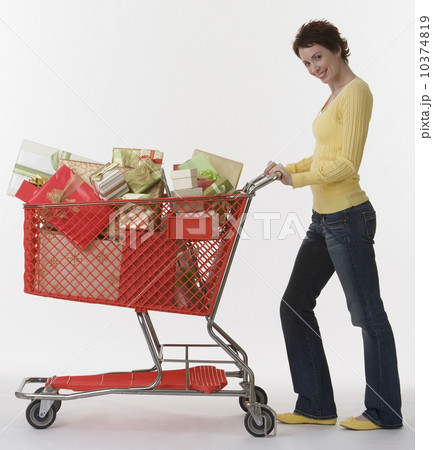 Woman pushing shopping cart of gifts Woman pushing shopping cart of gifts 10374819