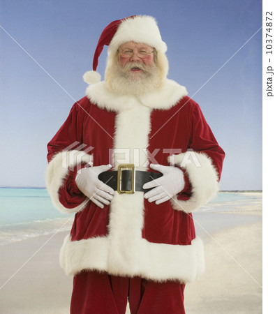 Santa Claus laughing at beach 10374872