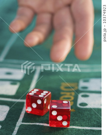 Close up of man throwing dice 10374923