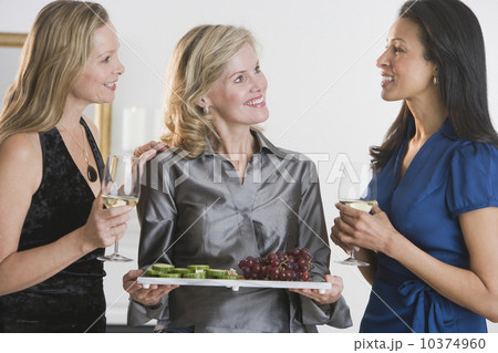 Woman offering tray of hors d’ouevers 10374960