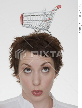 Woman with shopping cart on head 10374969