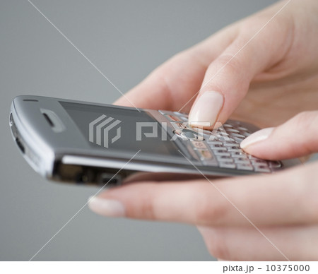 Woman dialing cell phone 10375000