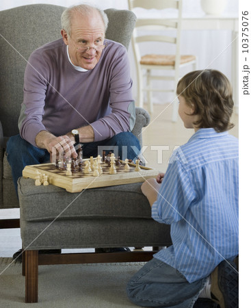 Grandfather and grandson playing chess 10375076