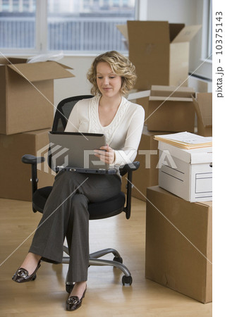 Businesswoman working in new office 10375143