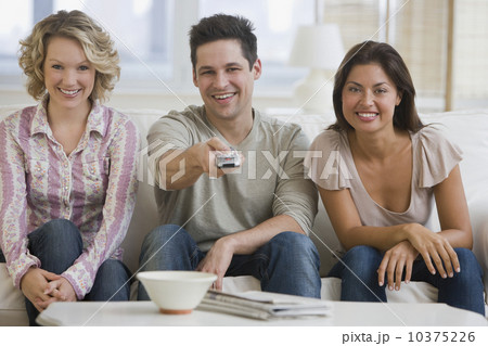 Multi-ethnic friends watching television 10375226