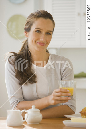 Woman drinking orange juice 10375366