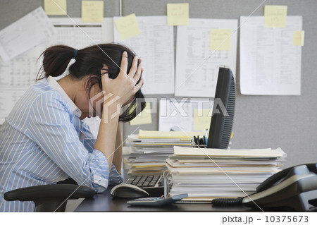 Businesswoman with head in hands Businesswoman with head in hands 10375673