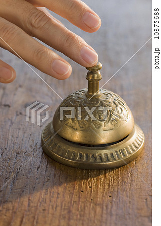 Man ringing service bell 10375688