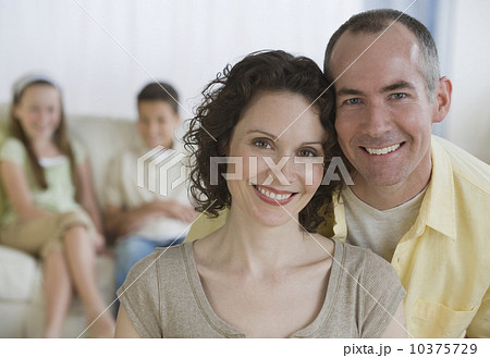 Parents with children in background Parents with children in background 10375729
