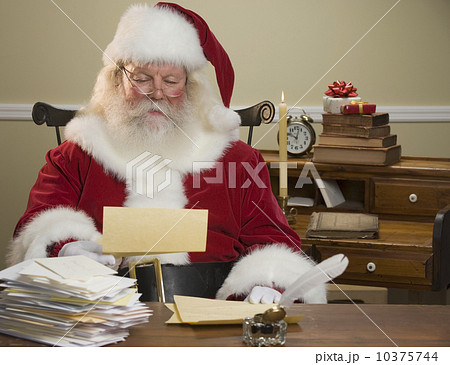 Santa Claus reading mail 10375744