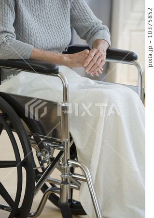 Senior woman sitting in wheelchair Senior woman sitting in wheelchair 10375852