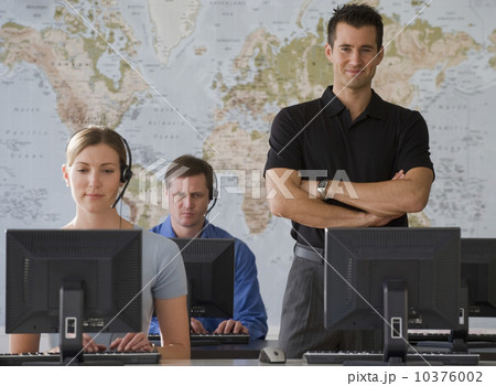 Call center employees with map in background 10376002