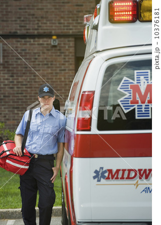 EMT posing in front of ambulance 10376181