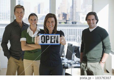 Portrait of business people holding ”Open” sign Portrait of business people holding ”Open” sign 10376307