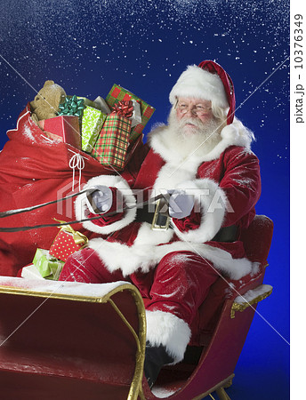 Santa Claus in sleigh with bag of toys 10376349