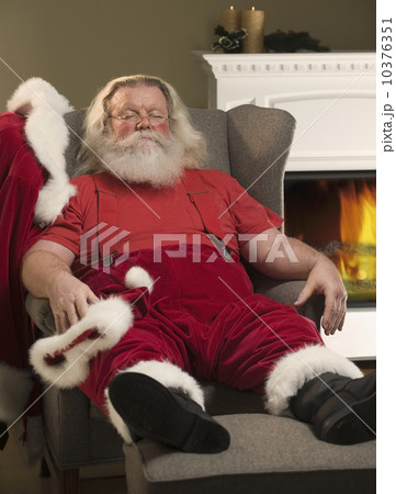 Santa Claus relaxing in armchair Santa Claus relaxing in armchair 10376351