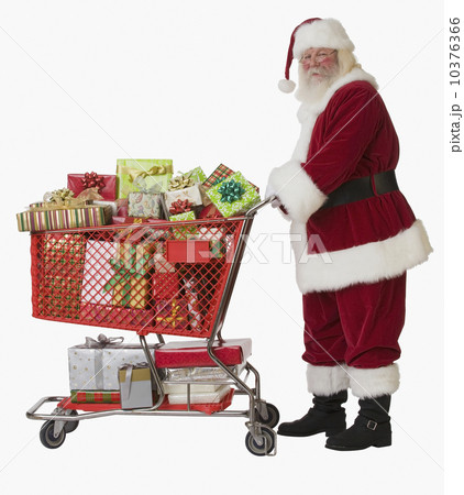 Santa Claus pushing shopping cart full of gifts 10376366