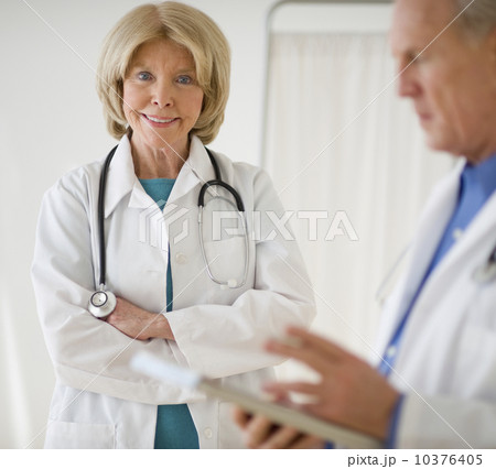 Senior female doctor with arms crossed Senior female doctor with arms crossed 10376405